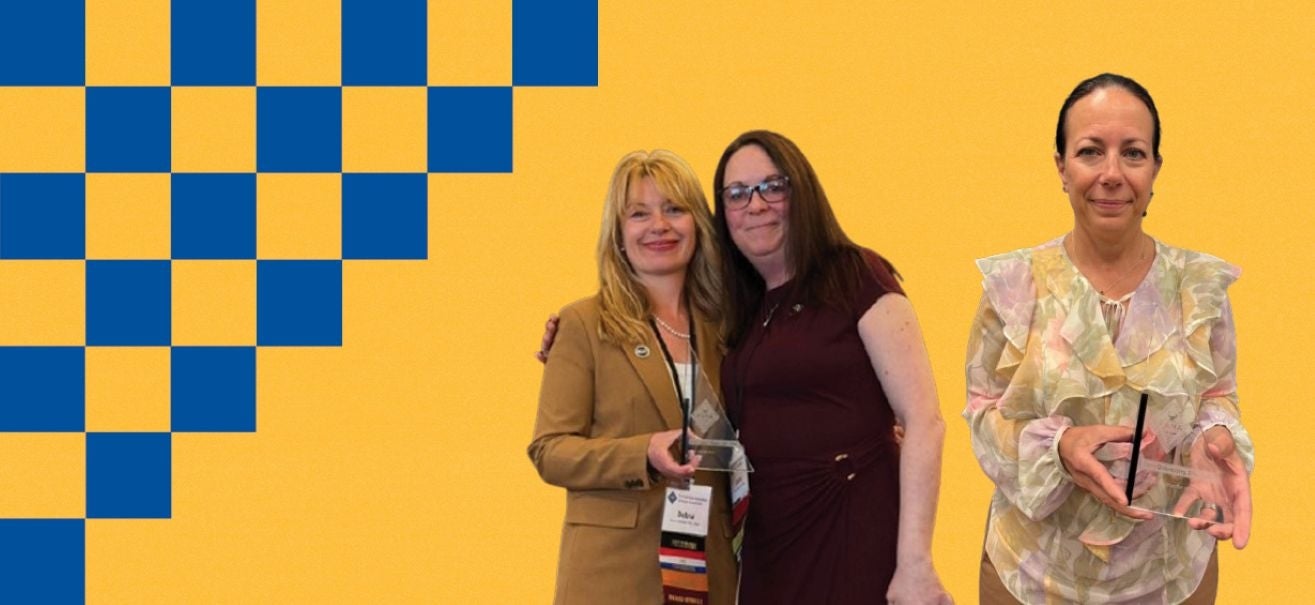 Photo of Dr. Kerry Quisenberry and Dr. Laura Wiggins with awards