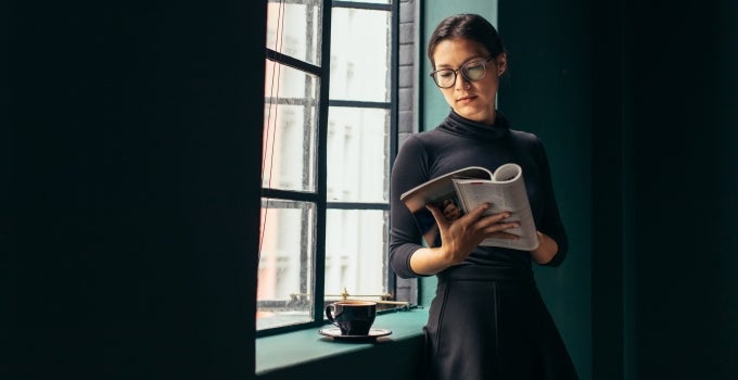 person reading by a window