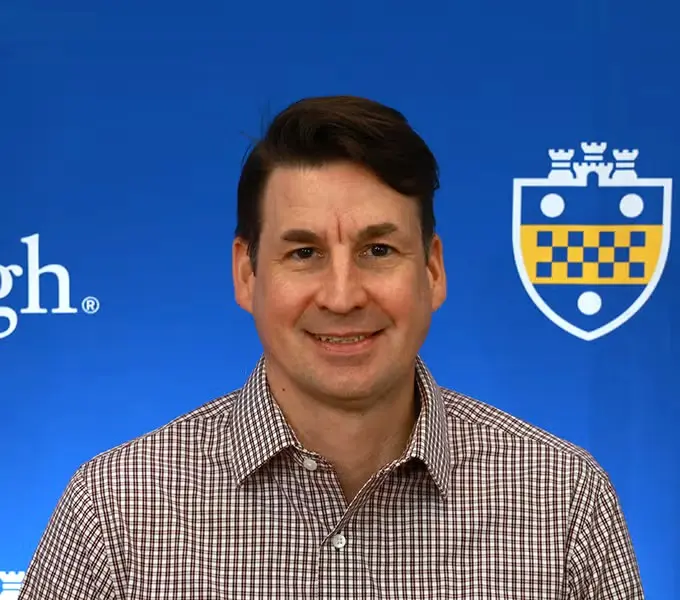 Headshot of faculty member Christopher Imes