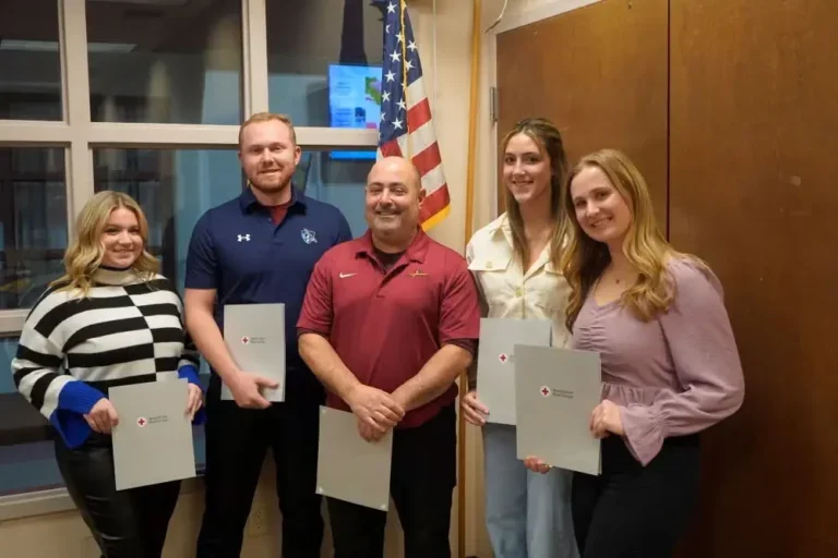 Photo of five recipients holding American Red Cross Lifesaving awards