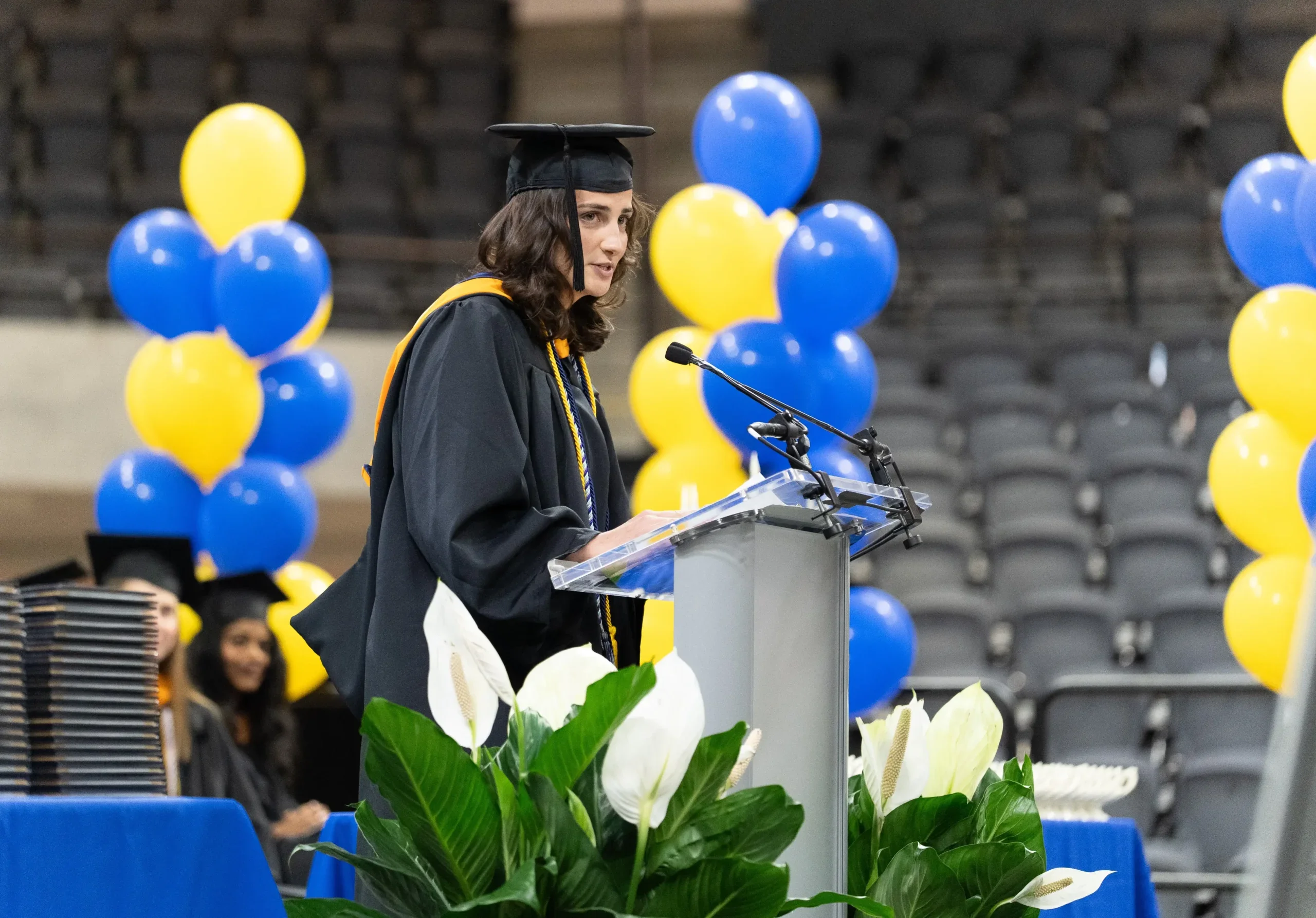 Kelly Cincotta speaking at spring nursing commencement ceremony